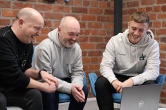 Seriös Group team around laptop