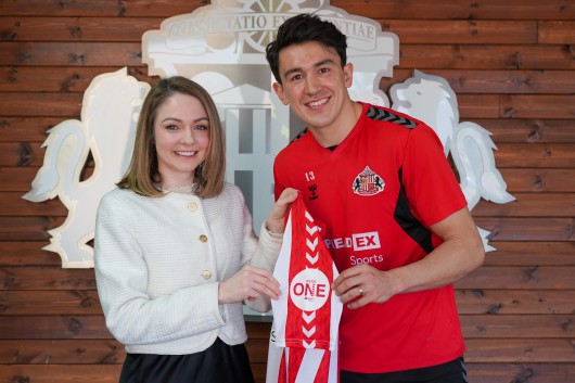Izy Herrera of Seriös Group and Luke O'Nien of Sunderland AFC